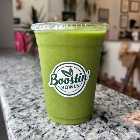 Yellow-green smoothie with almond milk, spinach, banana, mango, pineapple, and honey