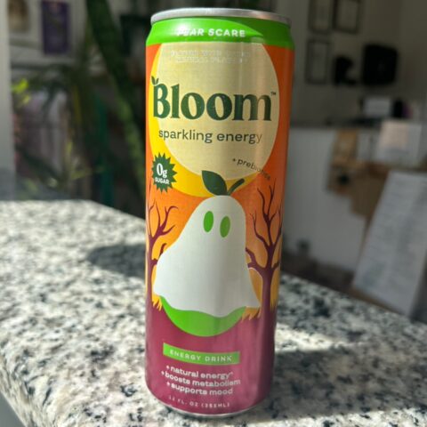 Pale yellow carbonated drink in a clear bottle with a white cap