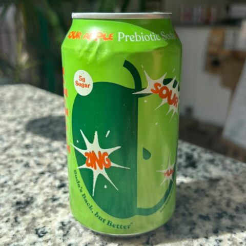 Green carbonated drink in a clear bottle